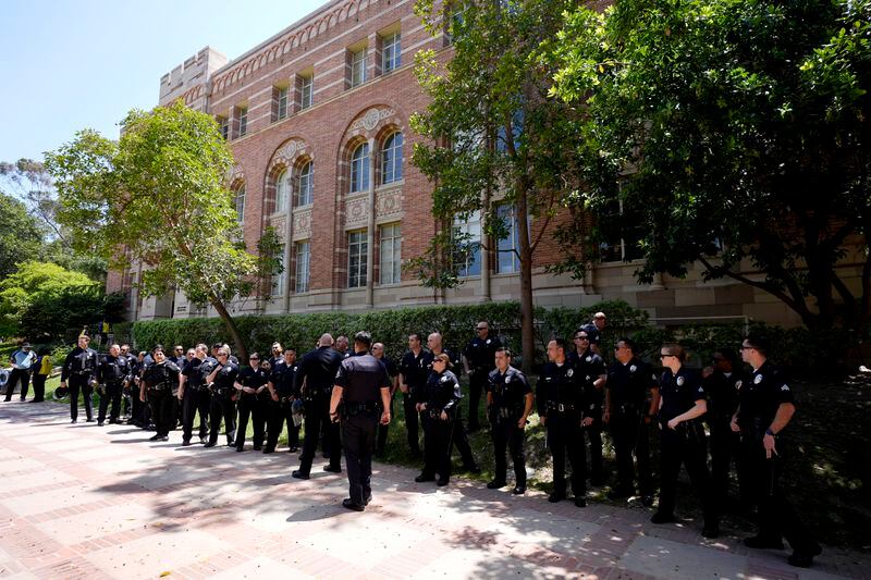 Police stage on the UCLA campus, after nighttime clashes between Pro-Israel and Pro-Palestinian groups, Wednesday, May 1, 2024, in Los Angeles. (AP Photo/Jae C. Hong)