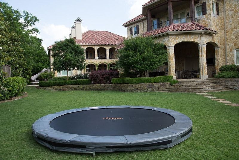 Entertain and exercise with a low profile trampoline perfect for kids and adults up to 352 pounds.  Courtesy of Sawyer Twain