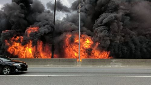 MARCH 30, 2017 Motorists pass by a colossal fire that caused the collapse of I-85 in Midtown at the height of rush hour Thursday evening, stranding thousands of motorists and shuttering a main gateway to the heart of Atlanta indefinitely. The northbound lanes of I-85 collapsed at Piedmont Road, just south of Ga. 400, about 7 p.m. as firefighters battled an intense blaze beneath the interstate. Authorities said they did not know the cause of the fire - but the Georgia State Patrol said there was no evidence of a terrorist attack. Courtesy Jackson Klinefelter