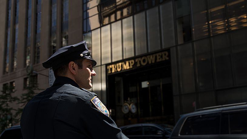 A New York City Police (NYPD) officer patrols across the street from Trump Tower, May 4, 2017 in New York City. President Donald Trump is returning to New York on Thursday for the first time since taking office and several protests are planned throughout the city.
