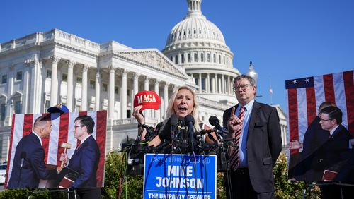 Rep. Marjorie Taylor Greene, R-Ga., joined by Rep. Thomas Massie, R-Ky., says she will call a vote on ousting House Speaker Mike Johnson, R-La., during a news conference at the Capitol in Washington on Wednesday.