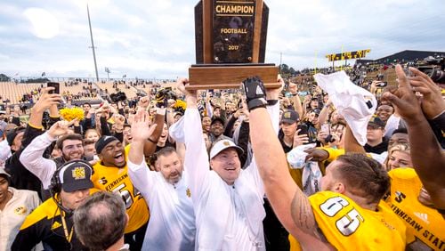 Kennesaw State coach Brian Bohannon and his Owls celebrate rout of Monmouth and the school's first conference championship. (Kyle Hess/Kennesaw State)