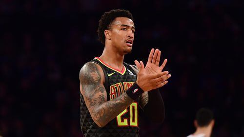 John Collins of the Atlanta Hawks claps during the third quarter of the game against New York Knicks at Madison Square Garden on December 21, 2018 in New York City.
