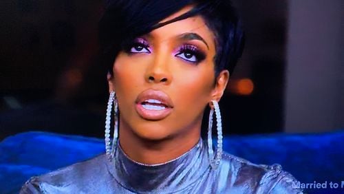 Porsha Williams listening to Drew Sidora rant about LaToya and Prophet Anthony Lott Jr. during the season 13 finale of "Real Housewives of Atlanta" that aired Sunday, April 18, 2021. BRAVO