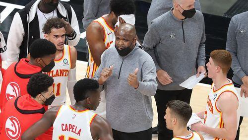 Hawks interim coach Nate McMillan address the huddle during a time out of 129-117 win Sunday, April 18, 2021, over the Indiana Pacers at State Farm Arena in Atlanta. (Curtis Compton / Curtis.Compton@ajc.com)
