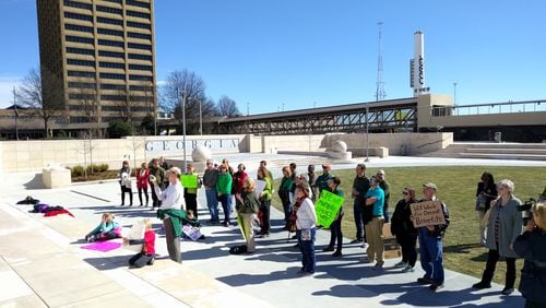 Feb. 16, 2016, Atlanta -- Parents and teachers with the group TRAGIC rally across the street from the Gold Dome. TY TAGAMI/AJC