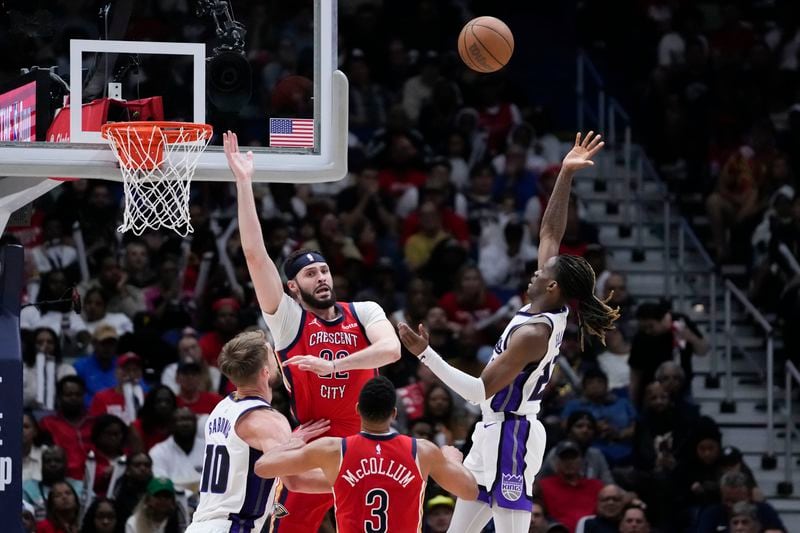 Sacramento Kings guard Keon Ellis shoots against New Orleans Pelicans forward Larry Nance Jr. in the second half of an NBA basketball play-in tournament game in New Orleans, Friday, April 19, 2024. The Pelicans won 105-98. (AP Photo/Gerald Herbert)
