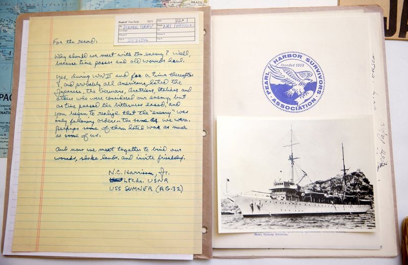 Some of Nat Harrison’s Pearl Harbor memorabilia is on display at the Atlanta History Center. It was donated to the museum by Cole Harrison, of Atlanta, Nat Harrison’s son. The senior Harrison recorded hours of audio documenting his experiences on the USS Sumner, which was based at Pearl Harbor during Japan’s surprise attack. Pictured are a photograph of the USS Sumner and a letter Nat Harrison wrote to a shipmate about how important it was to forgive Japan for the attack on Pearl Harbor. PHOTO / JASON GETZ