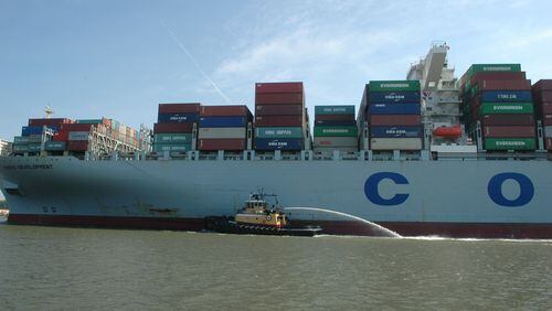 Savannah, Ga.: A pilot craft guides the Cosco Development, at the time the largest container ship to ever call on an East Coast port, as it plies through the Savannah River en route to the Garden City Terminal on the Savannah River on Thursday, May 11, 2017. J. Scott Trubey/strubey@ajc.com