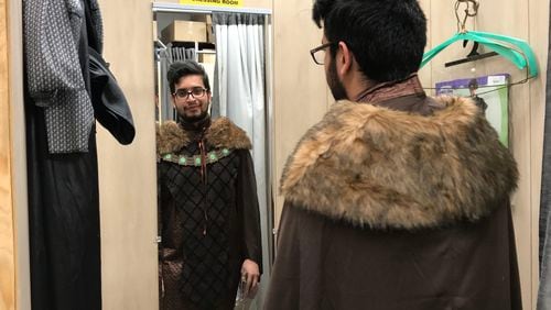 Daniel Brito tries on a costume as the "Forest Prince" for this weekend's annual Dragon Con Convention.  An  insurance salesman by day, Brito goes to Dragon Con for the networking and concerts. CREDIT: SHELIA POOLE