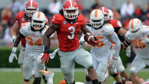 Georgia Bulldogs running back Todd Gurley en route to a touchdown against Tennessee at Sanford Stadium on Saturday, Sept. 27, 2014. BRANT SANDERLIN / AJC file
