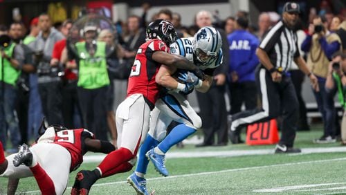 Carolina Panthers running back Christian McCaffrey (22) is tackled by Atlanta Falcons middle linebacker Deion Jones (45) during the second half of the game at Mercedes Benz Stadium, Sunday, December 31, 2017. The Atlanta Falcons beat the Carolina Panthers, 22-10.  ALYSSA POINTER/ALYSSA.POINTER@AJC.COM