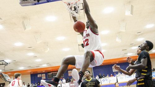 Spartanburg Day's Zion Williamson (12) makes a dunk while playing Keenan during the Chick-fil-A Classic at Richland Northeast High School on Dec. 22, 2016. (Tracy Glantz/The State/TNS)