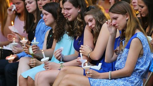 Students hold candles during the Memorial Service on Sweetheart Circle at Georgia Southern University for the five nursing students who died in a vehicle pileup on April 22, 2015, in Statesboro. Curtis Compton / ccompton@ajc.com