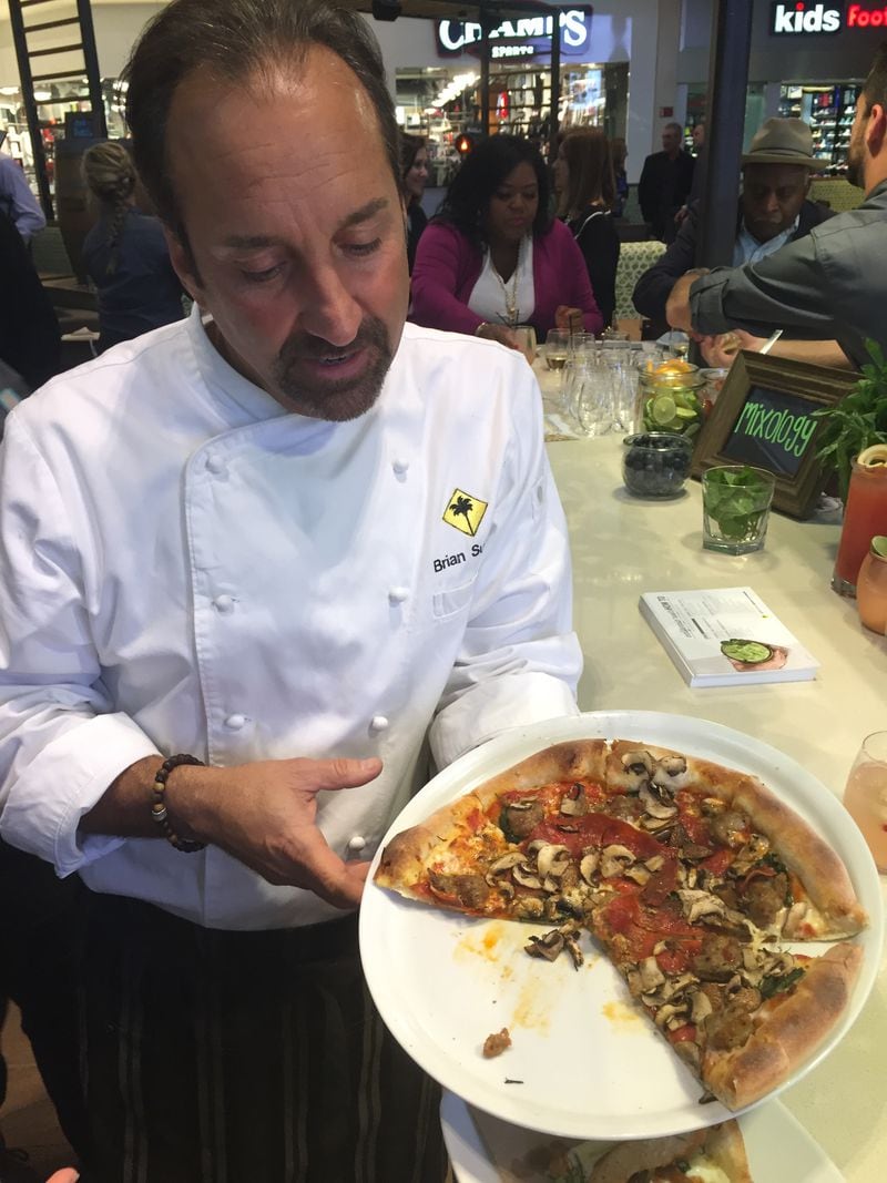 California Pizza Kitchen’s executive chef Brian Sullivan demos a pizza at the chain's flagship Atlanta location in Lenox Mall. Photo: Ana Santos/AJC