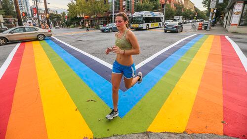 Motorists and pedestrians had a brand-new perspective of 10th Street and Piedmont Avenue in 2015. There was a project to paint rainbow crosswalks in Midtown for the launch of Atlanta Pride. Now, there’s a petition asking the city to permanently install at least one crosswalk in the gay flag colors in Midtown. JOHN SPINK /JSPINK@AJC.COM