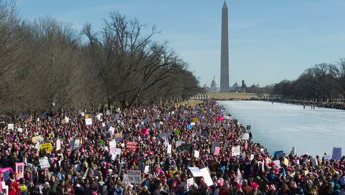 Participants in the Women's March gather near the Lincoln Memorial in Washington, Saturday, Jan. 20, 2018. On the anniversary of President Donald Trumps inauguration, people participating in rallies and marches in the U.S. and around the world Saturday denounced his views on immigration, abortion, LGBT rights, women's rights and more. (AP Photo/Cliff Owen)