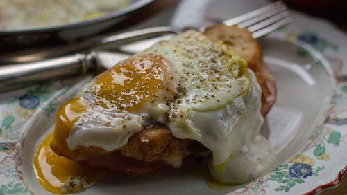 The classic croque madame, a grilled cheese topped with bechamel and a sunny-side-up egg. CONTRIBUTED BY HENRI HOLLIS