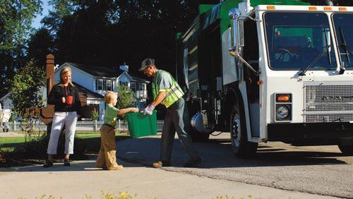 Woodstock has awarded a three-year a solid waste collection and recycling contract to Waste Management. AJC FILE