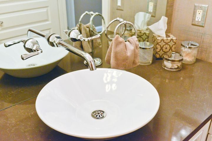 Soft, neutral colors in a bathroom with a granite countertop