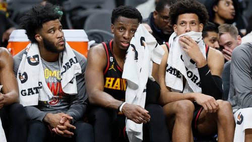 Hawks players (from left) Saddiq Bey, Onyeka Okongwu and Jalen Johnson react on the bench during their loss against the Timberwolves on Monday night at State Farm Arena. The Timberwolves won 136-115. (Jason Getz / Jason.Getz@ajc.com)