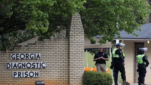 Corrections officers guard the entrance to the Georgia Diagnostic and Classification State Prison in advance of the scheduled execution of Joshua Bishop on Thursday evening, March 30, 2016. (Ben Gray / bgray@ajc.com)