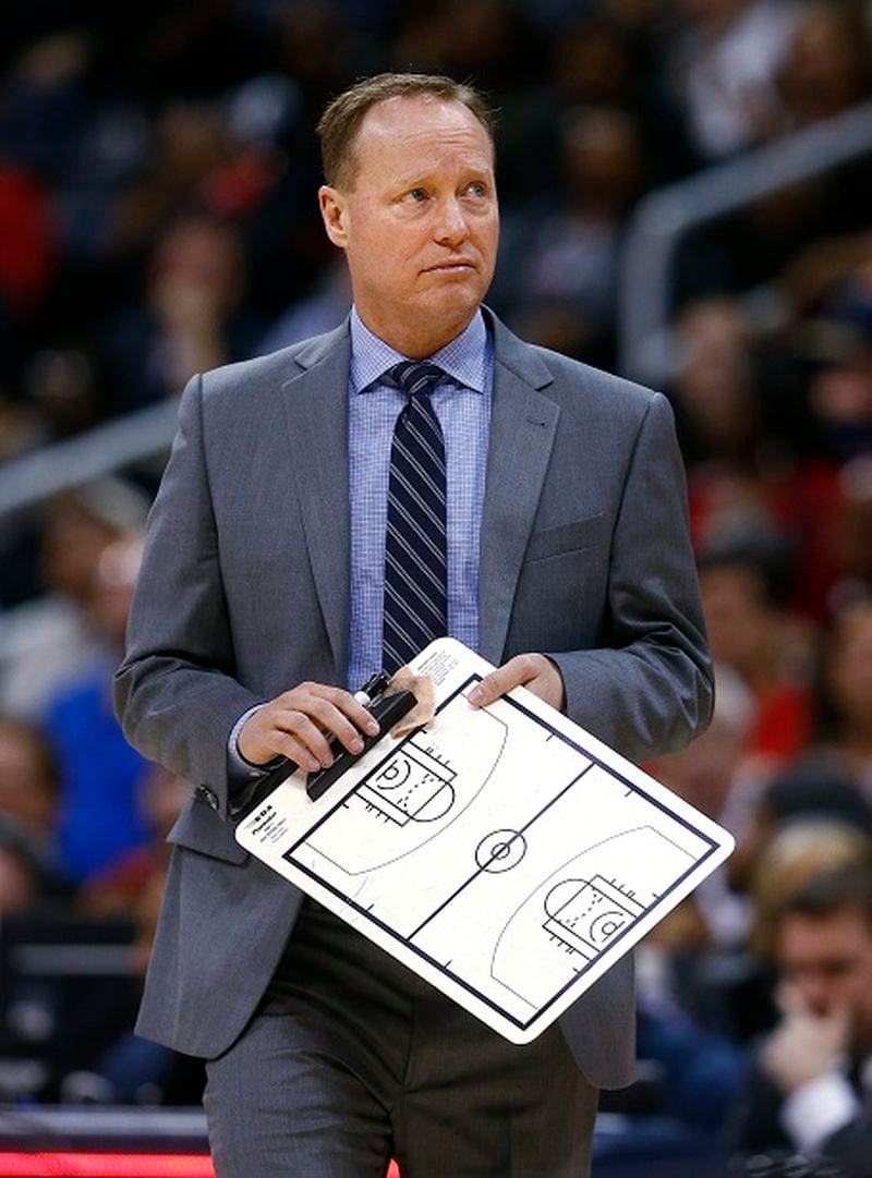 Atlanta Hawks coach Mike Budenholzer prepares to talk to his team during timeout in the second half of an NBA basketball game against the New York Knicks, Monday, April 13, 2015, in Atlanta. New York won 112-108. (AP Photo/John Bazemore) "Here's where I draw up my Langston Galloway defense." (AP Photo/John Bazemore)