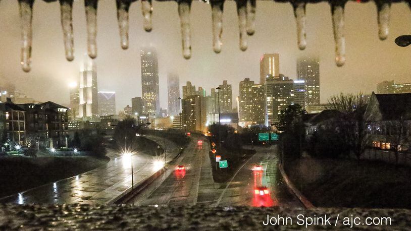 Ice and snow hit metro Atlanta Friday night. JOHN SPINK / JSPINK@AJC.COM