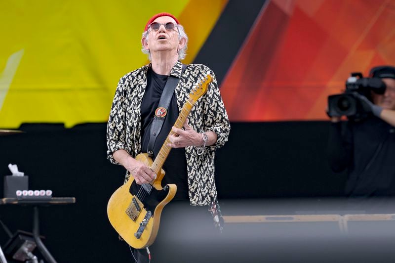 Keith Richards, of the Rolling Stones, performs during the New Orleans Jazz and Heritage Festival in New Orleans, Thursday, May 2, 2024. (AP Photo/Matthew Hinton)