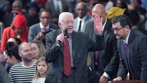 Former President Jimmy Carter waves as he is recognized during the last Sunday church service of 2018 at the historic Ebenezer Baptist Church in Atlanta on December 30, 2018. The Carter family selected the historic Atlanta church for their final Sunday church service of the year. (Photo: HYOSUB SHIN / HSHIN@AJC.COM)