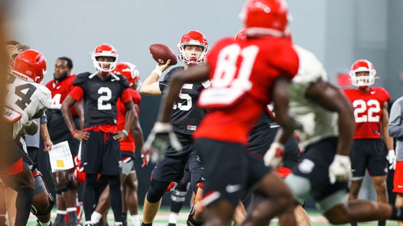 Georgia quarterback Carson Beck (15) takes snaps during the Bulldogs’ practice session Friday, Sept. 18, 2020, in Athens. (Tony Walsh/UGA Sports)