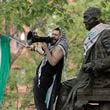 Qais Dana stands by the statue of Ben Franklin during a pro-Palestinian protest on College Green in the heart of the University of Pennsylvania campus in the in Philadelphia on Thursday, April 25, 2024. (Elizabeth Robertson/The Philadelphia Inquirer via AP)