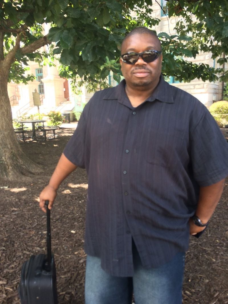 James Parham, a veteran, has mixed feelings about Confederate monuments, including the one outside the old DeKalb County courthouse. Removing them “is not going to cure racism,” he said. (Photo by Bill Torpy)