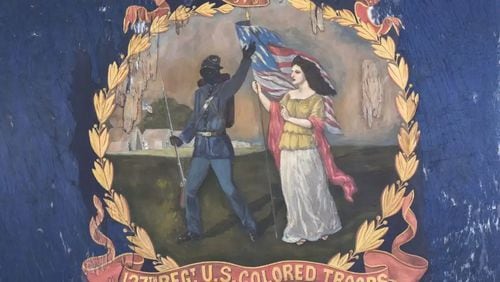 A rare Civil War battle flag from a regiment of U.S. Colored Troops shows a black soldier bidding farewell to a female figure representing "Columbia." The flag was acquired Thursday, June 13, by the Atlanta History Center. CONTRIBUTED: MORPHY AUCTIONS