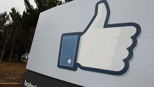 A sign with the “like” symbol stands in front of the Facebook headquarters on February 1, 2012 in Menlo Park, California. (Photo by Justin Sullivan/Getty Images)