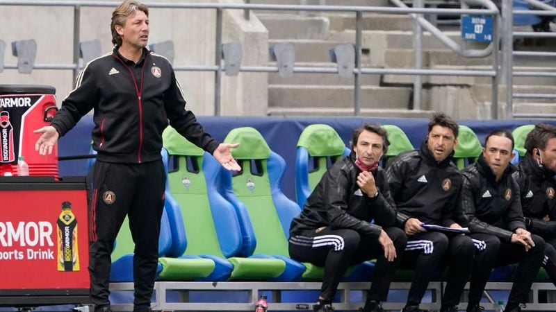 Atlanta United head coach Gabriel Heinze (left) gestures from the bench during the second half against the Seattle Sounders, Sunday, May 23, 2021, in Seattle. Heinze received a yellow card for arguing a call during the game. (Ted S. Warren/AP)