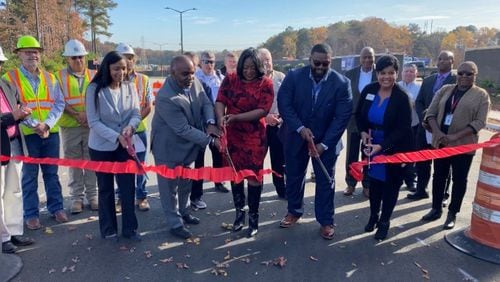 Leaders from Forest Park and Kroger cut the ribbon on new Rateree Road at the Gillem Logistics Center.