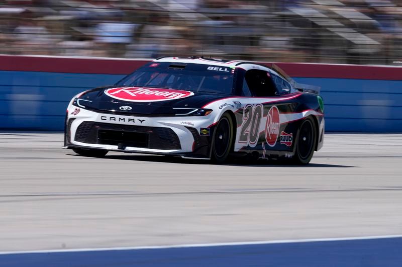 Christopher Bell (20) heads down the front stretch during a NASCAR Cup Series auto race at Texas Motor Speedway in Fort Worth, Texas, Sunday, April 14, 2024. (AP Photo/Tony Gutierrez)