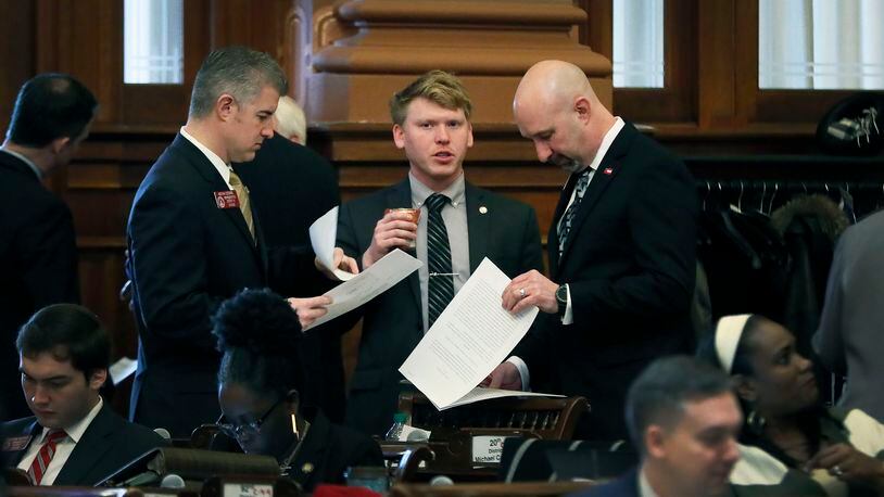2/22/19 - Atlanta - Rep. Kevin Cooke (from left), R - Carrollton, Rep. Matt Gurtler, R - Tiger, and  Rep. David Stover, R - Newnan, all signed on to a resolution asking Ralston to resign.  Several Republican lawmakers signed onto a resolution calling for Georgia House Speaker David Ralston to resign over his use of power to delay cases of defendants accused of crimes. Ralston said Friday he won't step down.   Friday, February 22, was the 20th legislative day, the halfway point, of the 2019 General Assembly. Bob Andres / bandres@ajc.com