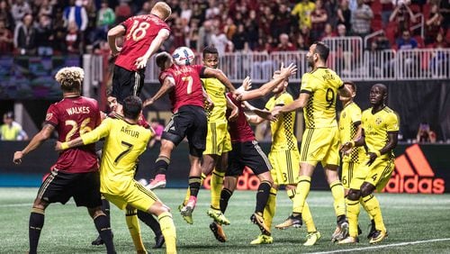 Atlanta United forward Josef Martinez (7) wins a header while taking a shot at the goal during an MLS game against at Columbus Crew at Mercedes-Benz Stadium, Thursday, Oct. 26, 2017, in Atlanta.  BRANDEN CAMP/SPECIAL
