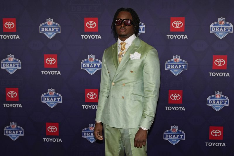 Alabama edge rusher Dallas Turner poses on the red carpet ahead of the first round of the NFL football draft, Thursday, April 25, 2024, in Detroit. (AP Photo/Carlos Osorio)