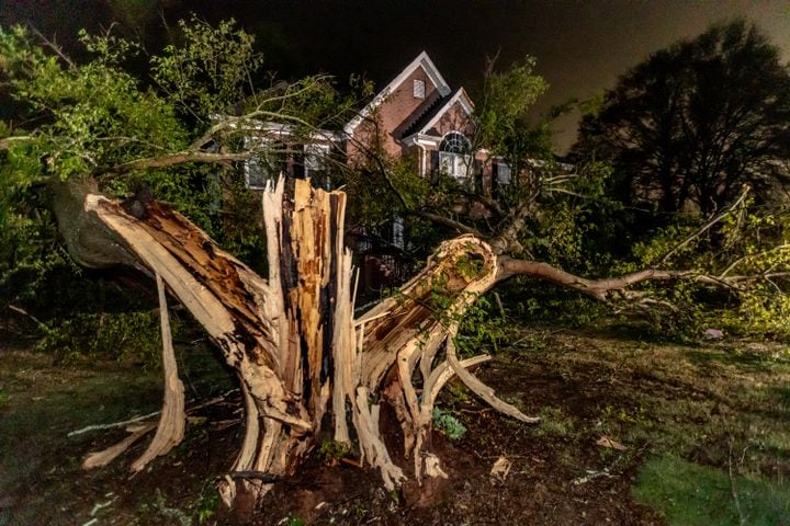 Severe storms toppled a tree on Wolverton Court in Conyers overnight Tuesday, April 3, 2024, in Rockdale County when storms moved through the region. (John Spink / John.Spink@ajc.com)