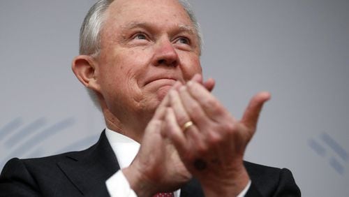 Attorney General Jeff Sessions applauds before speaking at a gathering in Washington on Monday, Dec. 4, 2017. (AP Photo/Carolyn Kaster)