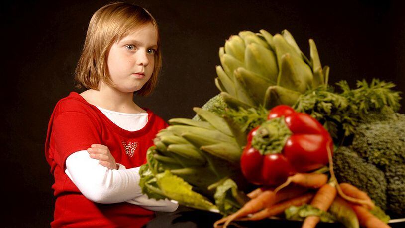 Sheridan Todd, 6, stares down a plate of vegetables in Walnut Creek, California on Wednesday, November 2, 2007. (Kristopher Skinner/Contra Costa Times/MCT)