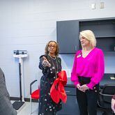 Lynne Meadows, Fulton County Schools' director of district health services, gives a tour of the private exam rooms at the opening of Fulton County’s first school-based health center at Banneker High School in College Park on Wednesday, Jan. 31, 2024. Fulton school board members Kristin McCabe and Katha Stuart are to the right. (Jenni Girtman for The Atlanta Journal-Constitution)