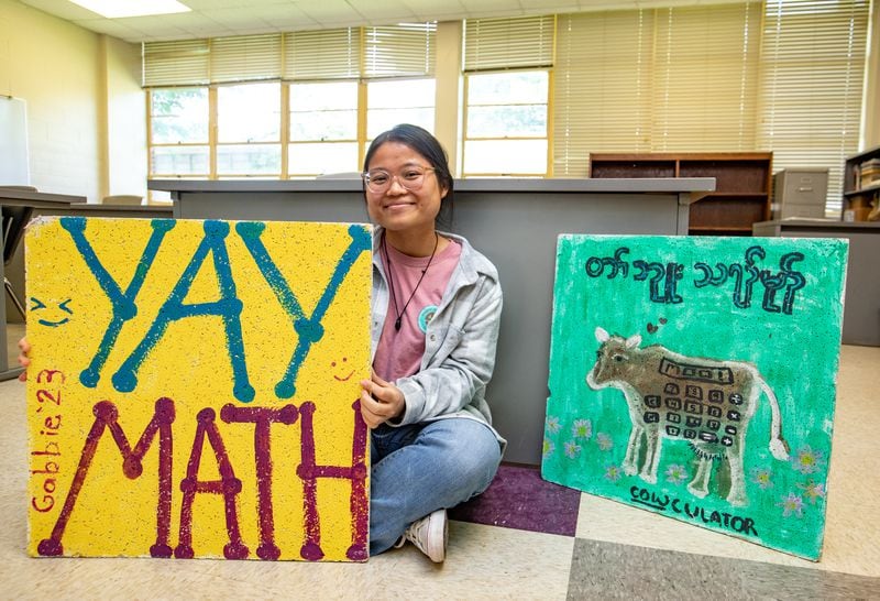 At the conclusion of her first year of teaching, Ku Htaw's students made her ceiling tiles to add to her classroom, painted with jokes relevant to their year. The 2022-2023 academic year was Htaw's first as a teacher at DeKalb School of the Arts. (Jenni Girtman for The Atlanta Journal-Constitution)