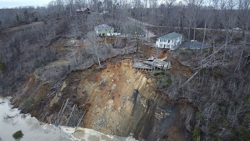 This drone photo provided by Hardin County Fire Department, Savannah, Tenn. on Feb. 15, 2030, shows the landslide on Chalk bluff on the Tennessee River.  Authorities say two homes were destroyed when a hillside collapsed near a swollen river in western Tennessee.