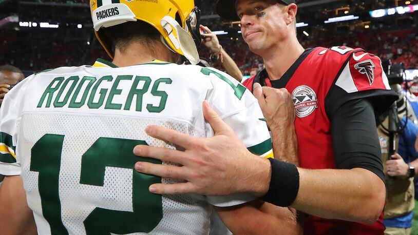 Falcons quarterback Matt Ryan and Packers quarterback Aaron Rodgers greet each other after the Falcons beat the Packers 34-23 Sunday, September 17, 2017, in Atlanta. (Curtis Compton/ccompton@ajc.com)