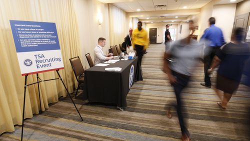People gather inside the Holiday Inn & Suites near the Atlanta airport, where the Transportation Security Administration held a job fair. TSA offers a $1,000 signing bonus for Atlanta airport jobs during the recruiting event Tuesday and Wednesday, June 7-8. Miguel Martinez / miguel.martinezjimenez@ajc.com