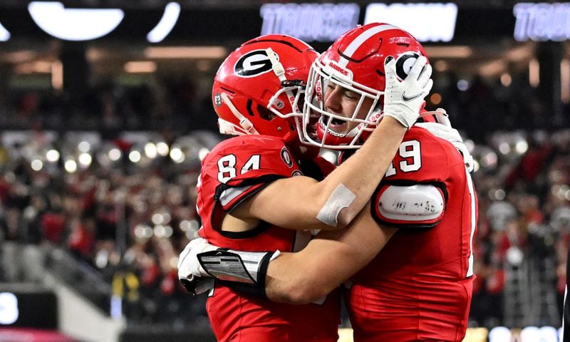 Georgia Bulldogs tight end Brock Bowers (19) celebrates with wide receiver Ladd McConkey (84) after a touchdown pass over TCU Horned Frogs safety Abraham Camara during the second half of the College Football Playoff National Championship at SoFi Stadium in Los Angeles on Monday, January 9, 2023. (Hyosub Shin / Hyosub.Shin@ajc.com)